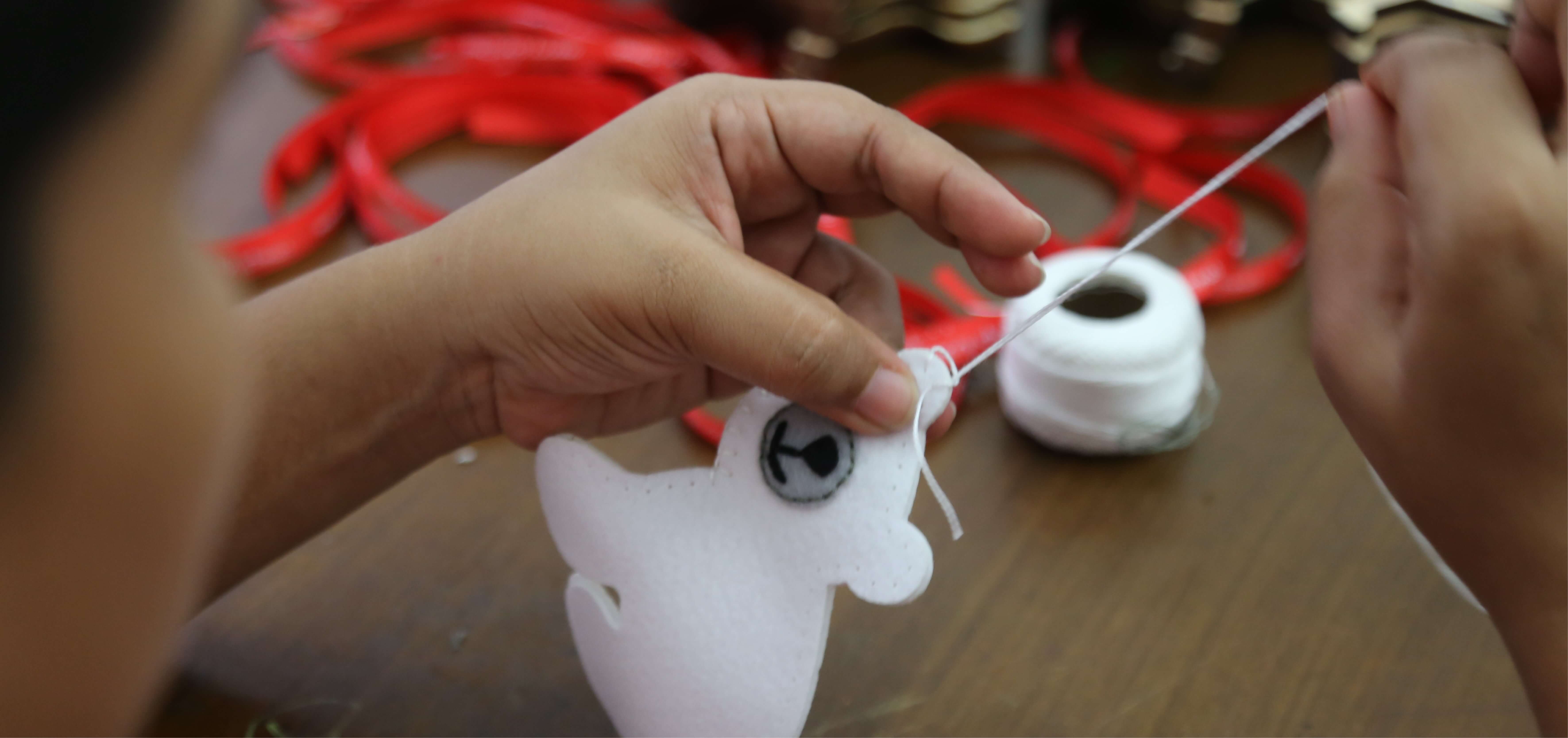 a women making a polar bear handcraft